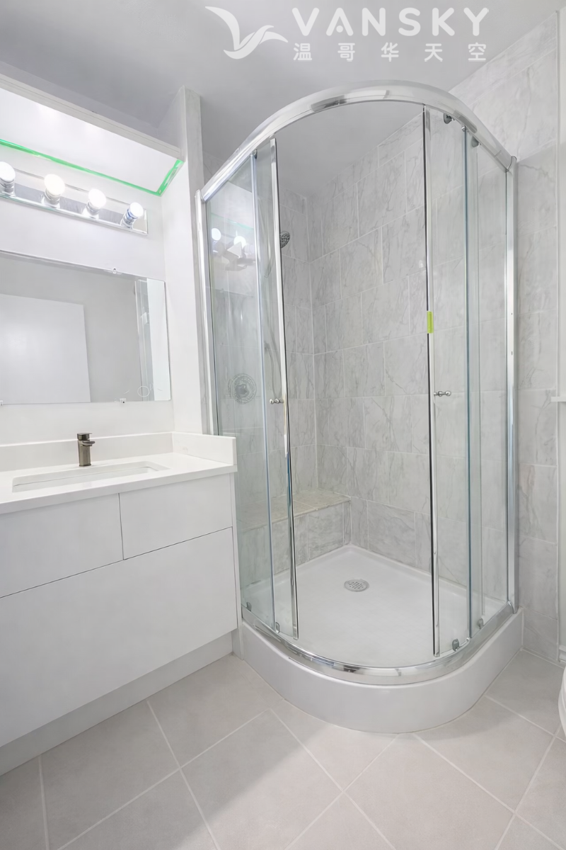 260404222452_Modern bathroom with curved shower enclosure.png